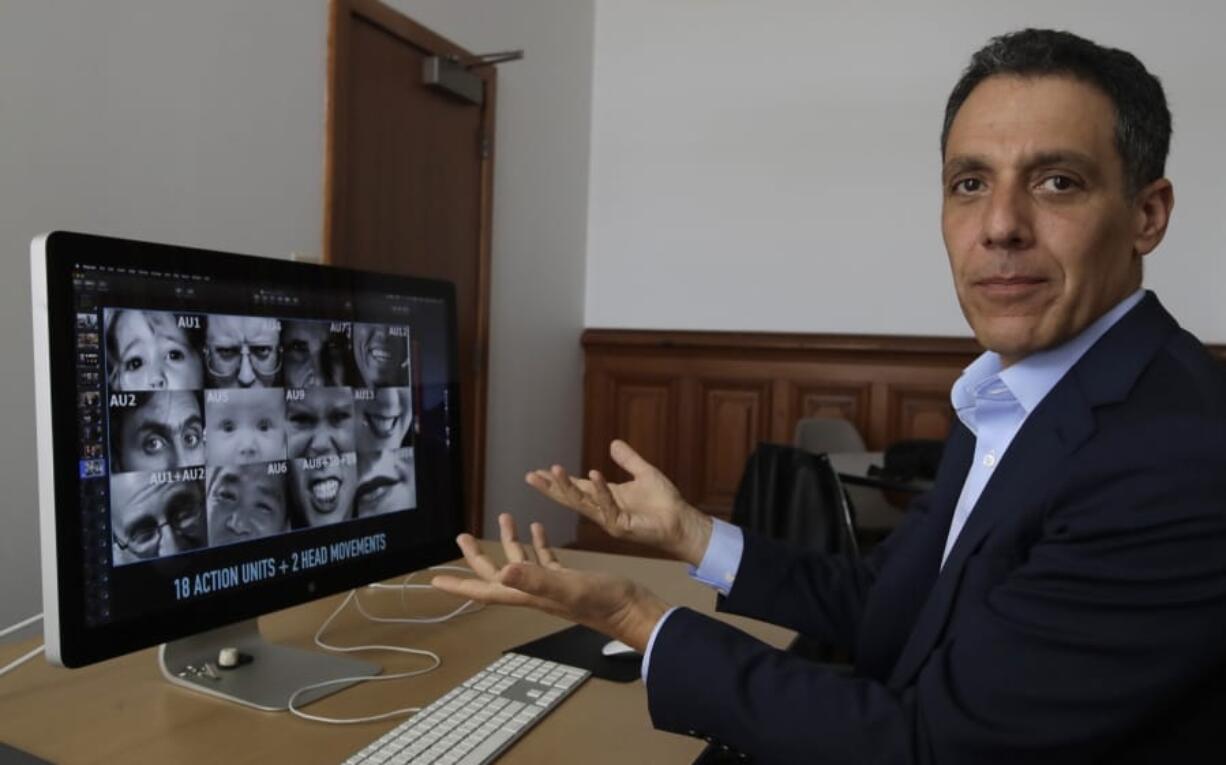 In this Monday, July 1, 2019, photo Hany Farid, a digital forensics expert at the University of California at Berkeley, gestures as he views video clips in his office in Berkeley, Calif. Dumb fakes, shallow fakes and cheap fakes, experts are still undecided on how to label the poorly made manipulated videos being viewed millions of times and even spread by high-ranking politicians. But they are sure that social media users will see much more of these videos ahead of the U.S. 2020 presidential elections.