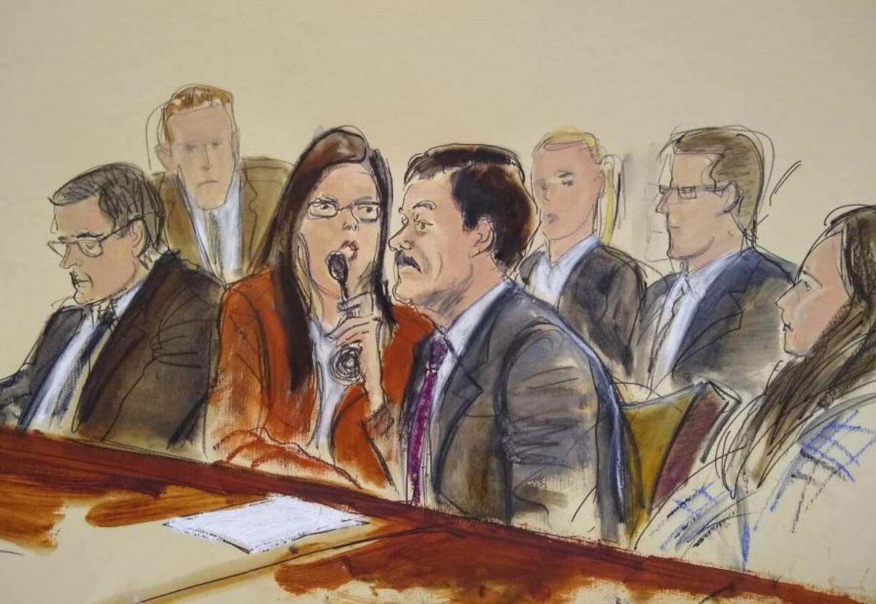 In this courtroom sketch, Joaquin “El Chapo” Guzman, right, listens to his sentence via interpreter Wednesday in New York. At left is defense attorney Marc Fernich.