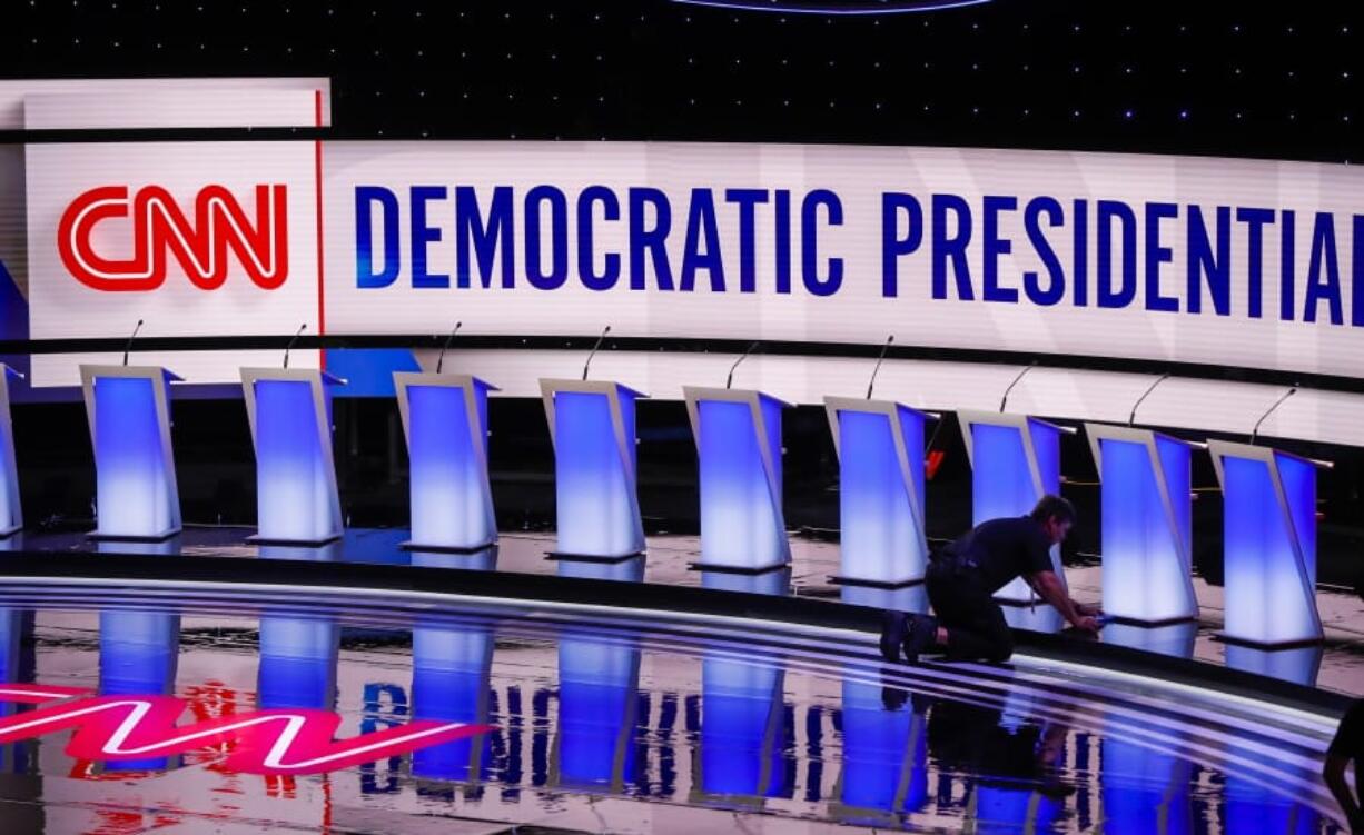 Workers get the stage ready for the Democratic primary debate hosted by CNN Tuesday, July 30, 2019, at the Fox Theatre in Detroit.