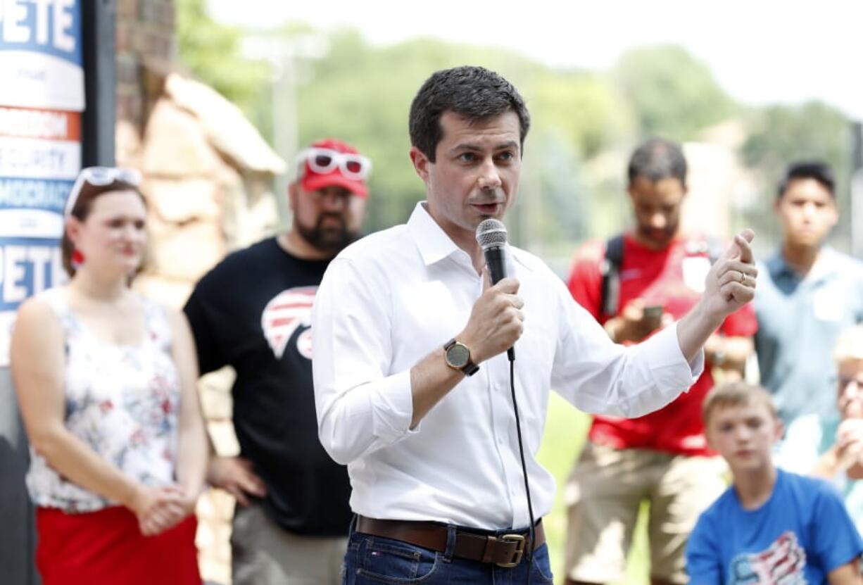 In this July 4, 2019 photo, Democratic presidential candidate South Bend Mayor Pete Buttigieg speaks at the Carroll County Democrats Fourth of July Barbecue in Carroll, Iowa. Buttigieg has money -- far more than the mayor of South Bend, Indiana, expected to have at this stage of the Democratic presidential primary. Now he needs to turn that money into a formidable campaign to ensure his support from donors is matched by backing from voters.