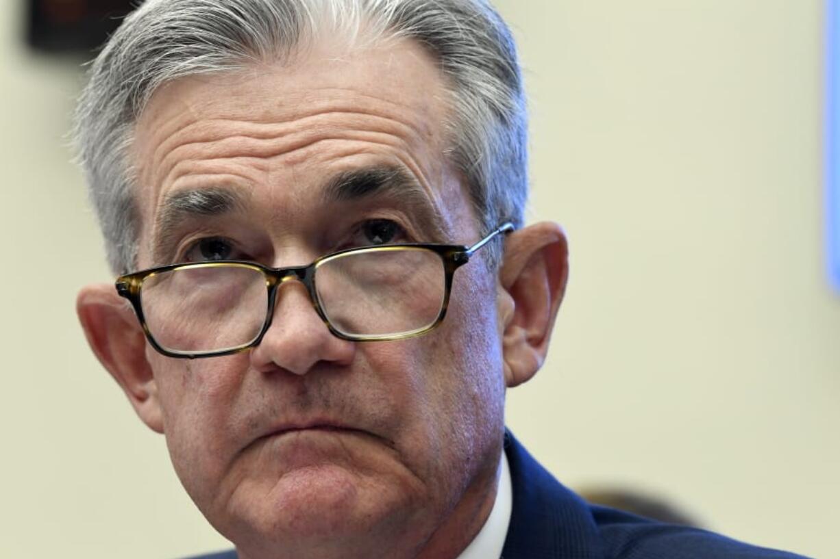 FILE - In this July 10, 2019, file photo Federal Reserve Chairman Jerome Powell testifies before the House Financial Services Committee on Capitol Hill in Washington. Powell has signaled that rising economic pressures, notably from President Donald Trump’s trade wars and from a global slowdown, have become cause for concern.