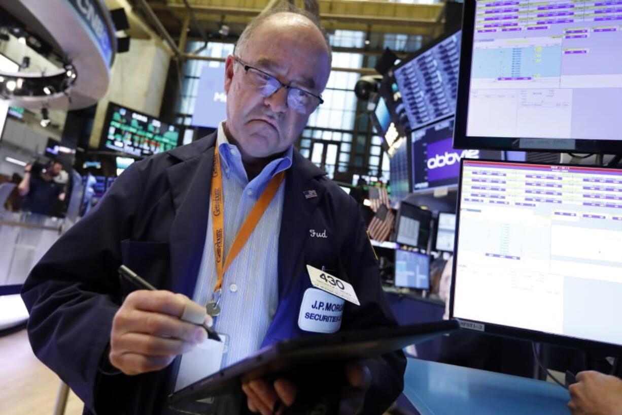 Trader Fred Reimer works on the floor of the New York Stock Exchange, Friday, July 19, 2019. U.S. stocks moved broadly higher in early trading on Wall Street Friday and chipped away at the week’s losses.