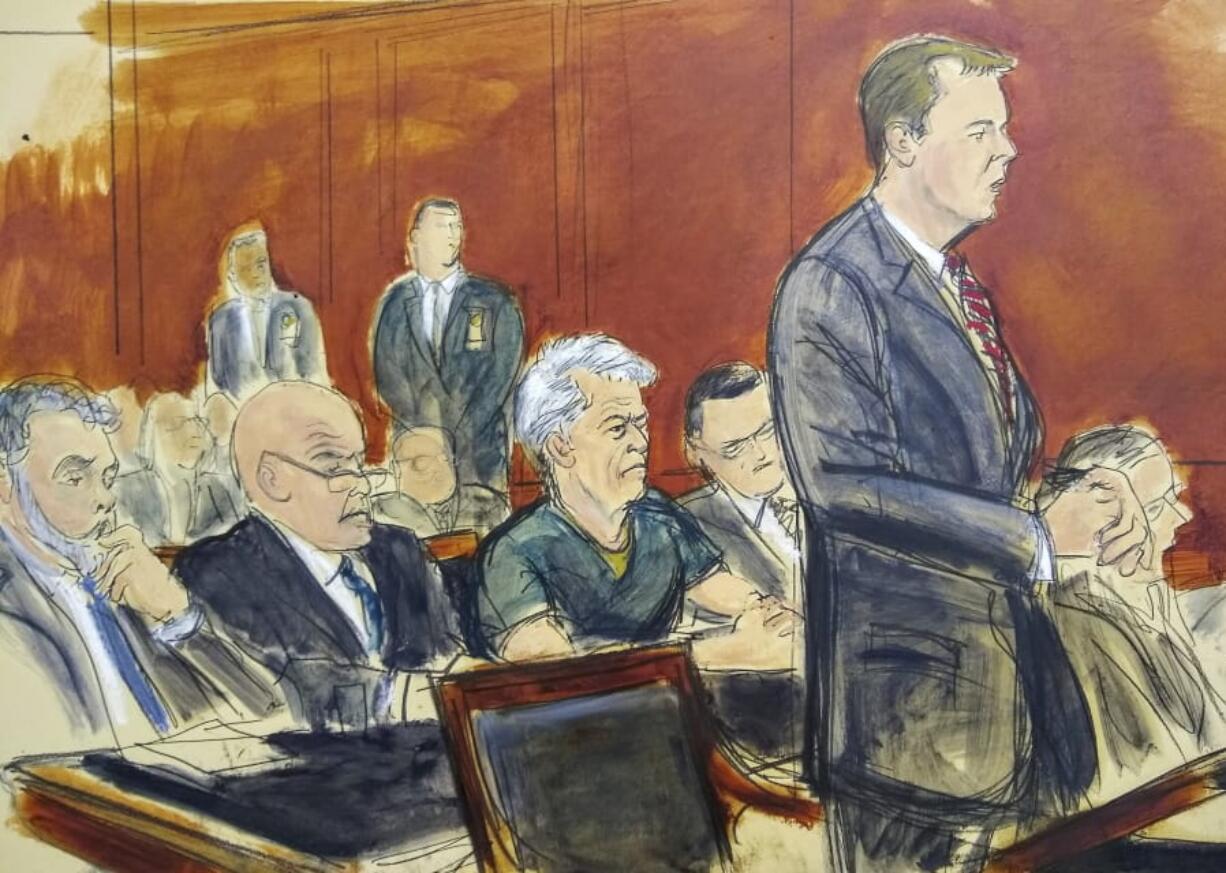 In this courtroom artist’s sketch, defendant Jeffrey Epstein, center, listens as Assistant U.S. Attorney Alex Rossmiller, right, addresses the court during Epstein’s arraignment, Monday, July 8, 2019 in New York. Epstein pleaded not guilty to federal sex trafficking charges. The 66-year-old is accused of creating and maintaining a network that allowed him to sexually exploit and abuse dozens of underage girls from 2002 to 2005.