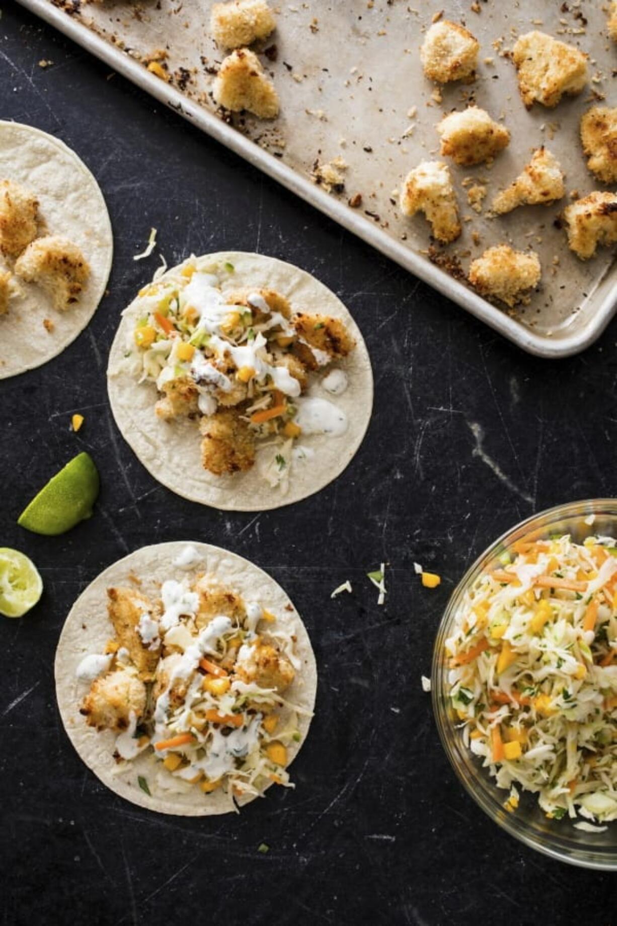 This undated photo provided by America’s Test Kitchen in July 2019 shows Baja-Style Cauliflower Tacos in Brookline, Mass. This recipe appears in the cookbook “Vegan for Everybody.” (Daniel J.