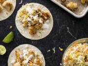 This undated photo provided by America’s Test Kitchen in July 2019 shows Baja-Style Cauliflower Tacos in Brookline, Mass. This recipe appears in the cookbook “Vegan for Everybody.” (Daniel J.