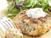 This undated photo provided by America’s Test Kitchen in July 2019 shows Grilled Southern Shrimp Burgers in Brookline, Mass. This recipe appears in the cookbook “Master of the Grill.” (Daniel J.