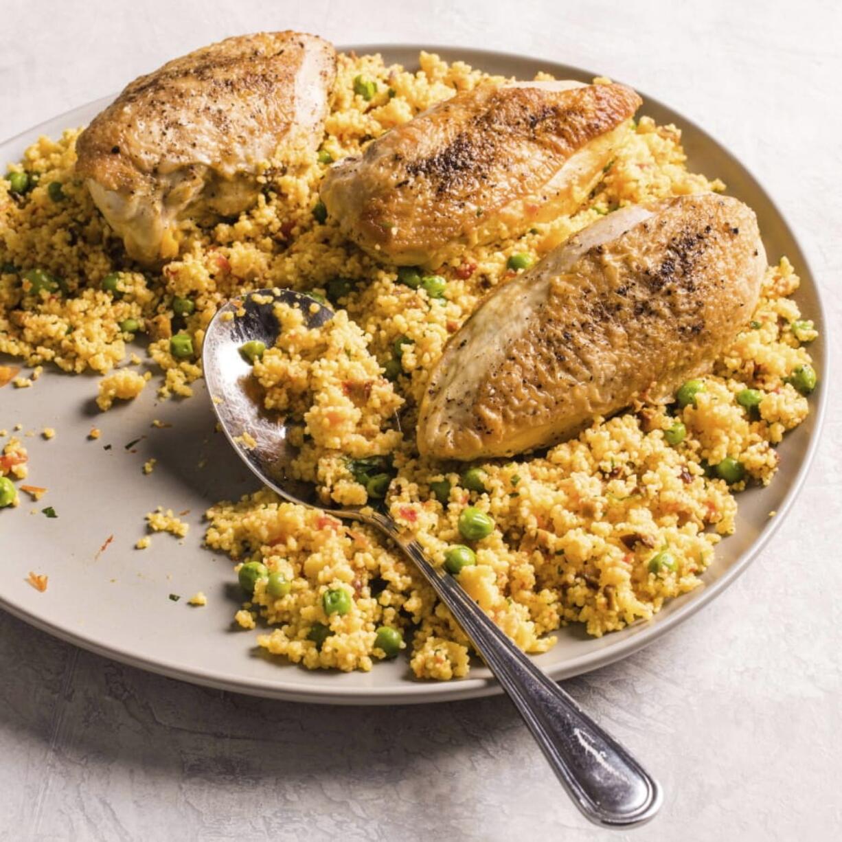 Spanish-Style Chicken and Couscous from the cookbook “Multicooker Perfection.” Carl Tremblay/America’s Test Kitchen