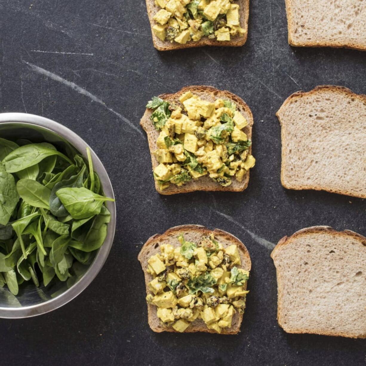 This undated photo provided by America’s Test Kitchen in June 2019 shows Turmeric Chicken Salad Sandwiches in Brookline, Mass. This recipe appears in the cookbook “Nutritious Delicious.” (Daniel J.