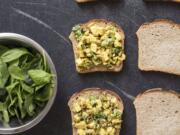 This undated photo provided by America’s Test Kitchen in June 2019 shows Turmeric Chicken Salad Sandwiches in Brookline, Mass. This recipe appears in the cookbook “Nutritious Delicious.” (Daniel J.