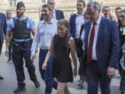 Swedish climate activist Greta Thunberg, centre, arrives for a meeting Tuesday at the French National Assembly in Paris, France.