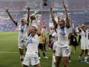 United States’ Megan Rapinoe , center left, celebrates with teammates their victory in the Women’s World Cup final soccer match between US and The Netherlands at the Stade de Lyon in Decines, outside Lyon, France, Sunday, July 7, 2019. US won 2:0.