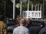 Supporters of the Thirty Meter Telescope, foreground, gather for a rally outside the Hawaii State Capitol in Honolulu on Thursday, July 25, 2019, as opponents of the telescope gather across the street. Supporters said the giant telescope planned for Hawaii’s tallest mountain will enhance humanity’s knowledge of the universe and bring quality, high-paying jobs, as protesters blocked construction for a second week.