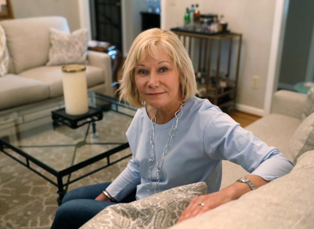 Cancer patient Kim Lauerman poses for a portrait in her home Wednesday, June 26, 2019, in Alpharetta, Ga. After Lauerman was diagnosed with ovarian cancer, doctors wanted to give her a drug that helps prevent infections and fever during chemotherapy. Her insurer said no. Doctors say they worry about the growing influence insurers have over patient care. They say treatment delays and the problems they create are becoming common because routine things like imaging exams or prescriptions now require insurer approval first.