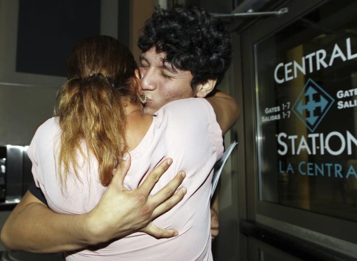 Francisco Galicia, right, kisses his mother Sanjuana Galicia at the McAllen, Texas, Central Station, Wednesday, July 24, 2019. Galicia, 18, who was born in the U.S. was released Tuesday, July 23, from federal immigration custody after wrongfully being detained for more than three weeks.