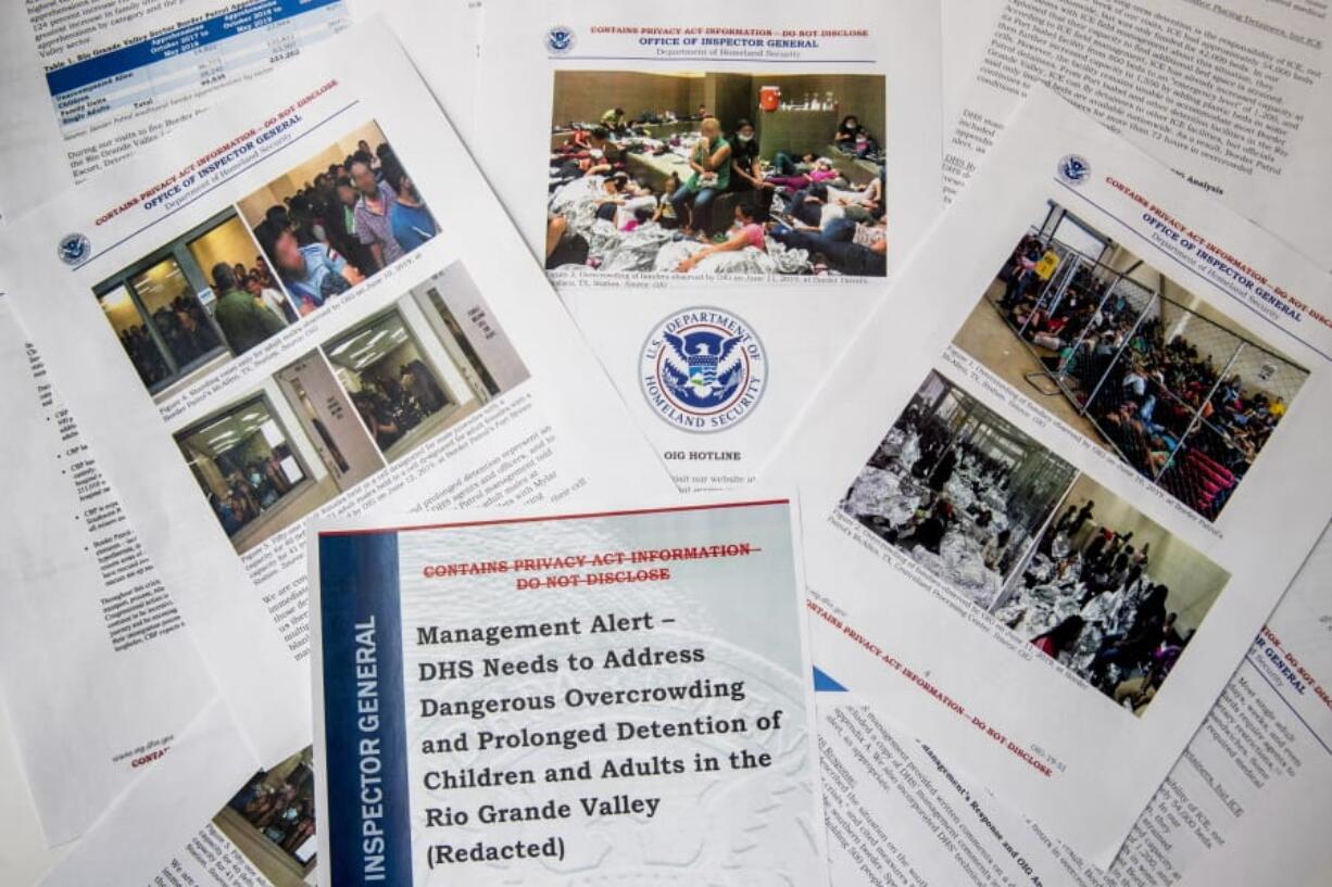 A portion of a report from government auditors reveals images of people penned into overcrowded Border Patrol facilities, photographed Tuesday, July 2, 2019, in Washington.