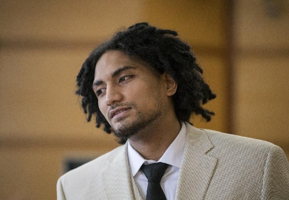 Thomas Leae, a Renton man allegedly involved in the 2015 robbery and shooting death of a Vancouver precious metals shop employee, prepares to leave the courtroom after opening statements in his murder trial Tuesday morning in Clark County Superior Court.