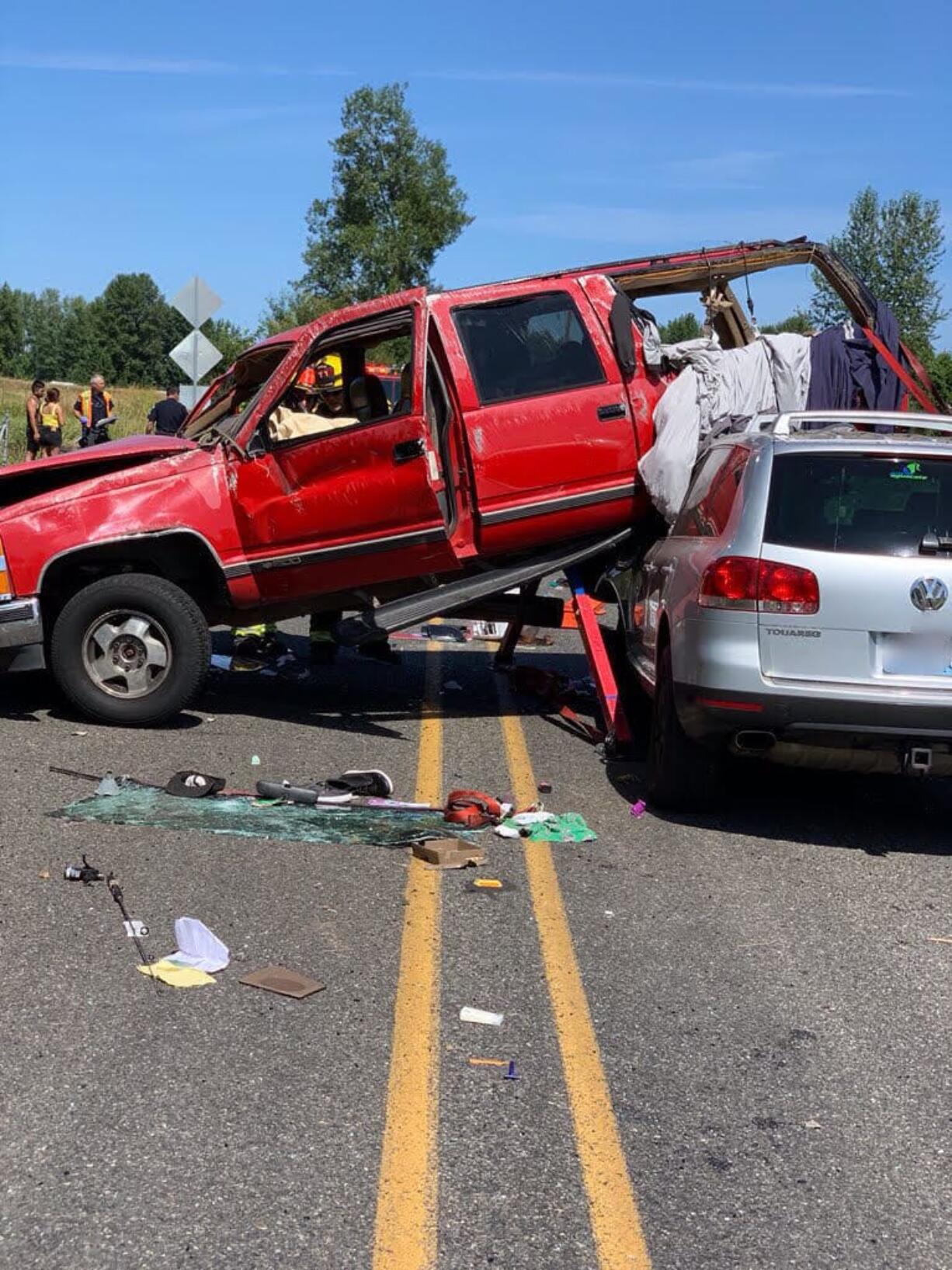 A Chevy Suburban landed partially on top of a Volkswagen SUV on Sunday afternoon on Northwest Erwin O. Rieger Memorial Highway and Northwest Lower River Road.