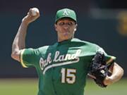 Oakland Athletics pitcher Homer Bailey works against the Seattle Mariners in the first inning of a baseball game Wednesday, July 17, 2019, in Oakland, Calif.