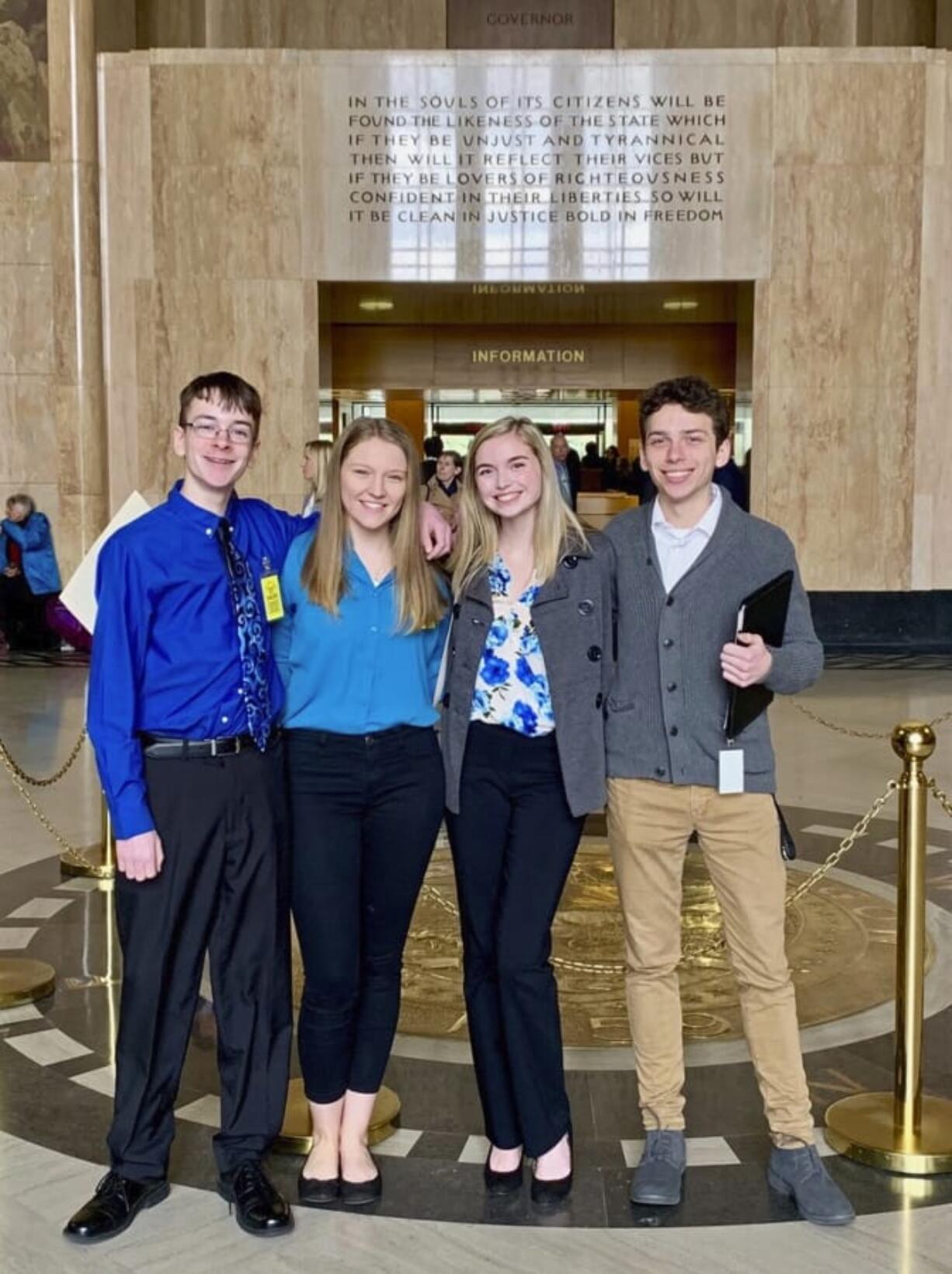 Sam Adamson, from left, Lori Riddle, Hailey Hardcastle, and Derek Evans pose Feb. 6 at the Oregon State Capitol in Salem, Ore. The teens introduced legislation to allow students to take “mental health days” as they would sick days in an attempt to respond to a mental health crisis gripping the state.