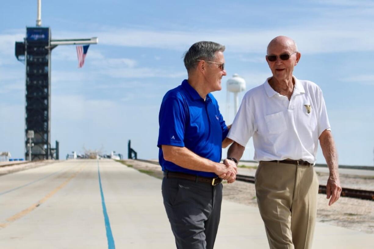 Astronaut Michael Collins, right, speaks Tuesday with Kennedy Space Center Director Robert Cabana at Launch Complex 39A about the moments leading up to the Apollo 11 launch at 9:32 a.m. on July 16, 1969.