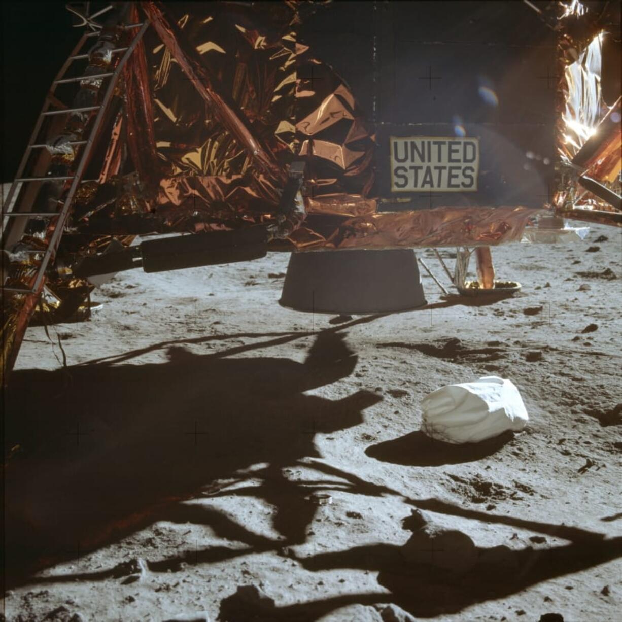 This July 20, 1969 photo made available by NASA shows the Lunar Module descent stage and area of soil beneath. In landing on the moon, the astronauts were traveling horizontally for a while, so the thrusters weren’t pointed down and wouldn’t have kicked up any dust, astronomer Emily Drabek-Maunder at the Royal Observatory Greenwich in London says. But when the module finally did touch down, “you can see dust actually being thrown up.” As for the lack of a crater, Roger Launius, NASA’s former chief historian, said the astronauts didn’t need to use a large blast to slow themselves down, because the moon’s gravity is roughly one-sixth that of Earth’s. “It was more of a gentle landing,” he said.