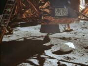 This July 20, 1969 photo made available by NASA shows the Lunar Module descent stage and area of soil beneath. In landing on the moon, the astronauts were traveling horizontally for a while, so the thrusters weren’t pointed down and wouldn’t have kicked up any dust, astronomer Emily Drabek-Maunder at the Royal Observatory Greenwich in London says. But when the module finally did touch down, “you can see dust actually being thrown up.” As for the lack of a crater, Roger Launius, NASA’s former chief historian, said the astronauts didn’t need to use a large blast to slow themselves down, because the moon’s gravity is roughly one-sixth that of Earth’s. “It was more of a gentle landing,” he said.