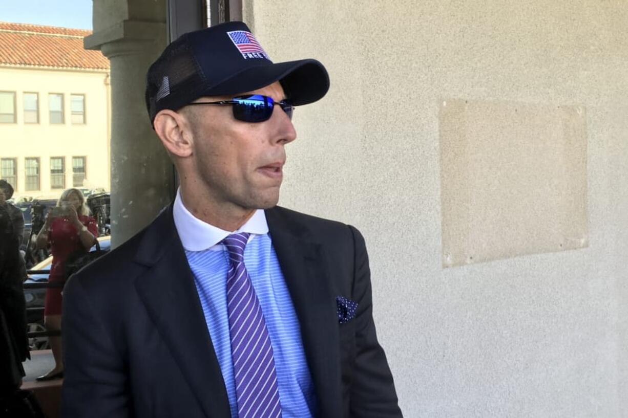 Marc Mukasey, defense lawyer for Navy Special Operations Chief Edward Gallagher, arrives to military court on Naval Base San Diego, Tuesday, July 2, 2019, in San Diego. Jury deliberations continued Tuesday morning in the court-martial of the decorated Navy SEAL, who is accused of stabbing to death a wounded teenage Islamic State prisoner and wounding two civilians in Iraq in 2017. He has pleaded not guilty to murder and attempted murder, charges that carry a potential life sentence.