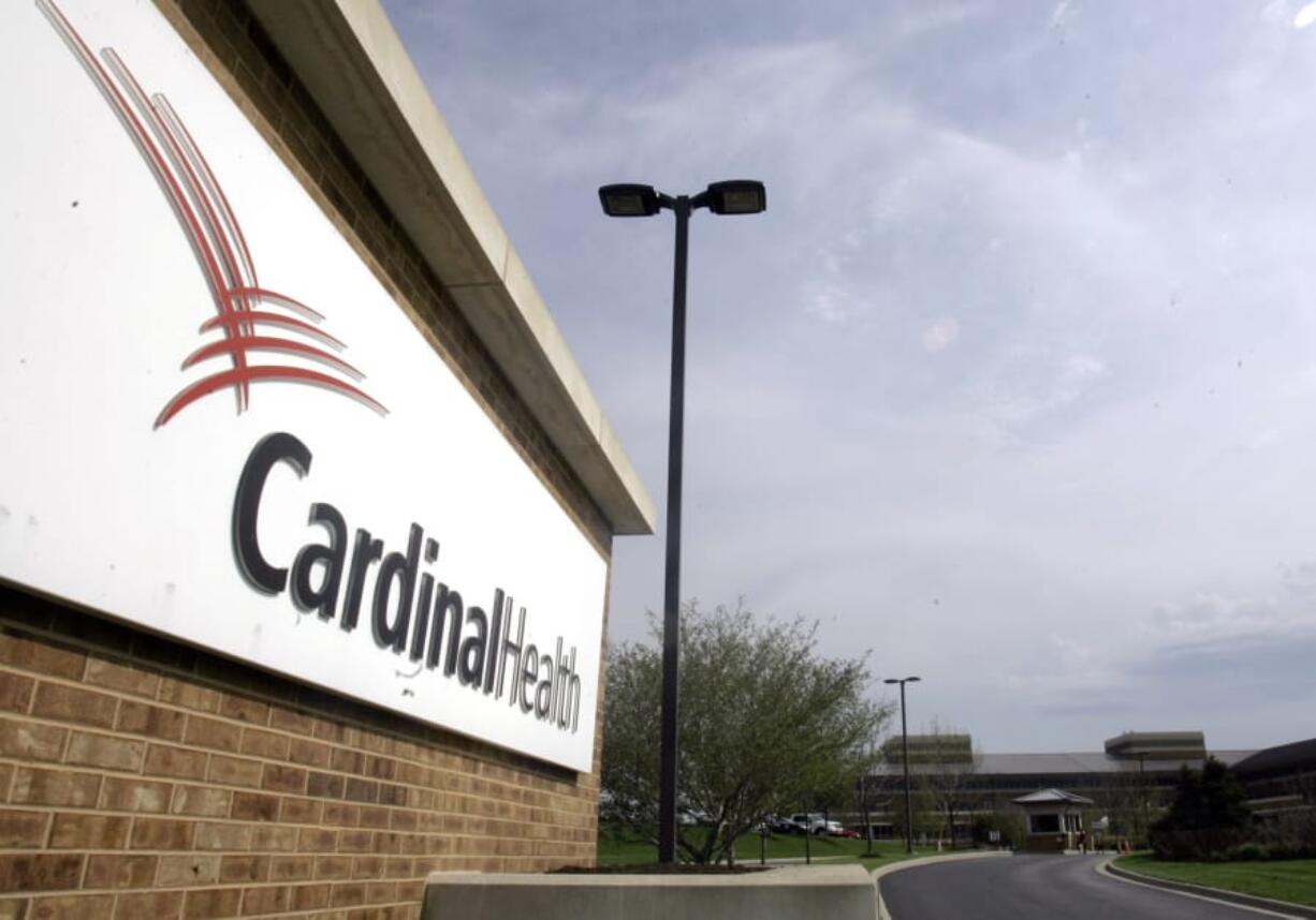 FILE - This April 30, 2007, file photo, shows the headquarters of Cardinal Health in Dublin, Ohio. An executive at Cardinal Health, one of the nation’s largest drug distribution companies, said in a legal proceeding that the business has no obligation to the public when it comes to shipping prescription opioid painkillers. That’s one of the disclosures in thousands of pages of court documents made public July 23, 2019, in lawsuits over the opioid crisis.