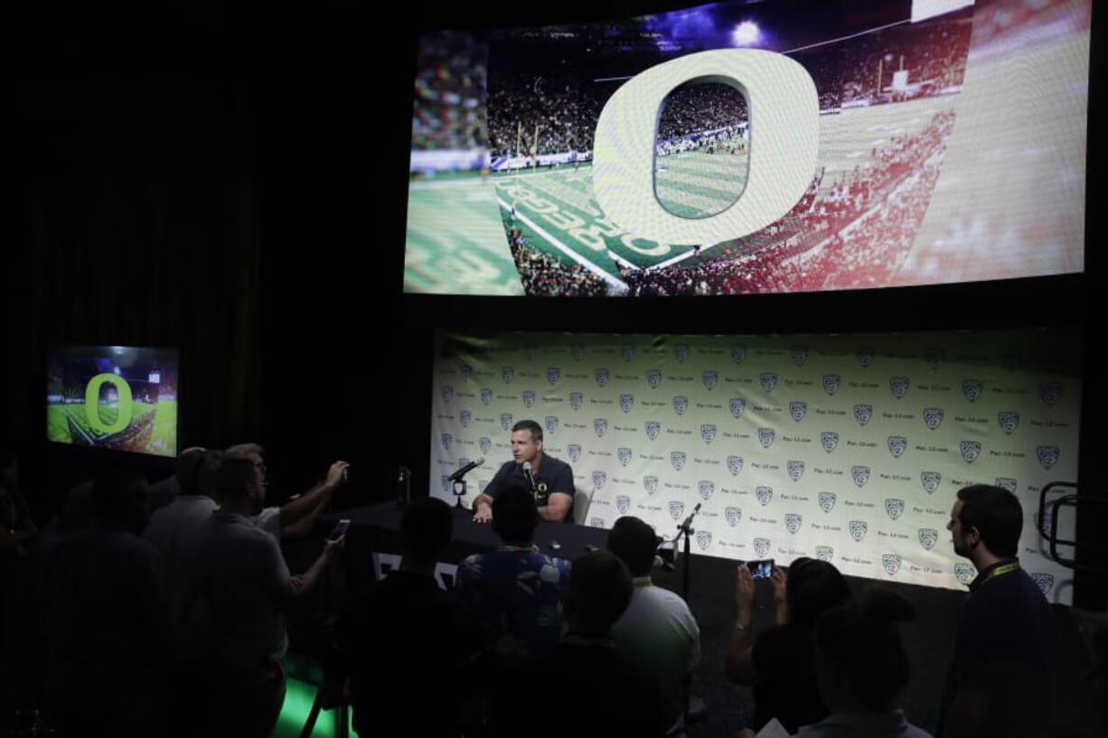 Oregon head coach Mario Cristobal answers questions during the Pac-12 Conference NCAA college football Media Day Wednesday, July 24, 2019, in Los Angeles.