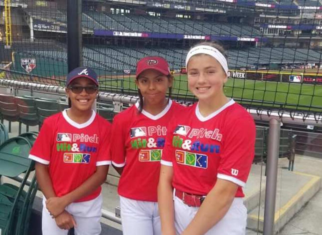 Ridgefield's Elizabeth Peery, right, along with MLB Pitch Hit & Run finalists Mariah Harrison of Fort Mitchell, Ala., left, and Danica Gutierrez of Maricopa, Ariz., representing the Arizona Diamondbacks, at Cleveland's Progressive Field on Saturday, July 6, 2019. Harrison won the 11-12 softball age group with Gutierrez second and Peery third.