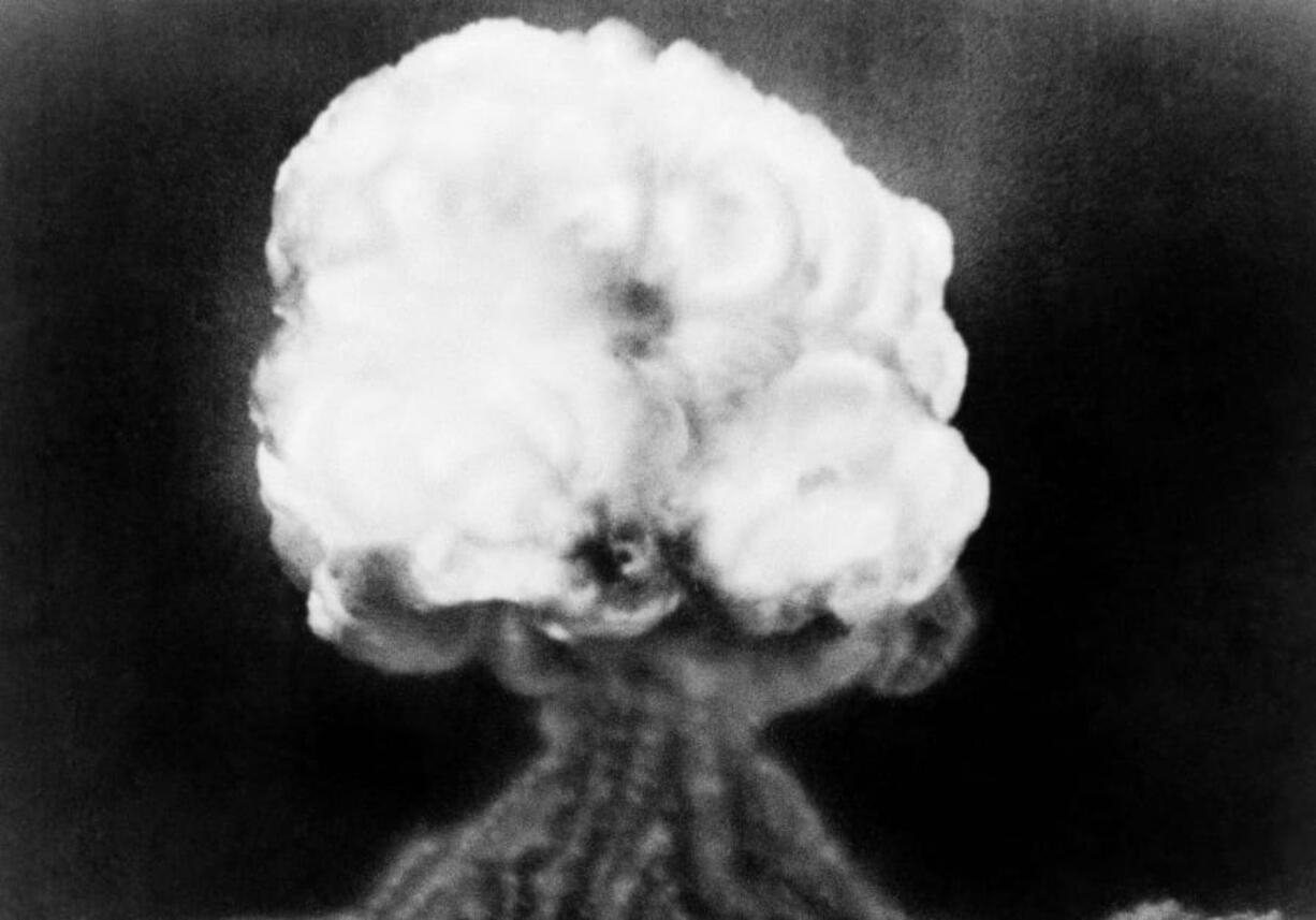 FILE - This July 16, 1945, file photo, shows the mushroom cloud of the first atomic explosion at Trinity Test Site near Alamagordo, N.M. A compensation program for those exposed to radiation from years of nuclear weapons testing and uranium mining would be expanded under legislation that seeks to address fallout across the western United States, Guam and the Northern Mariana Islands.