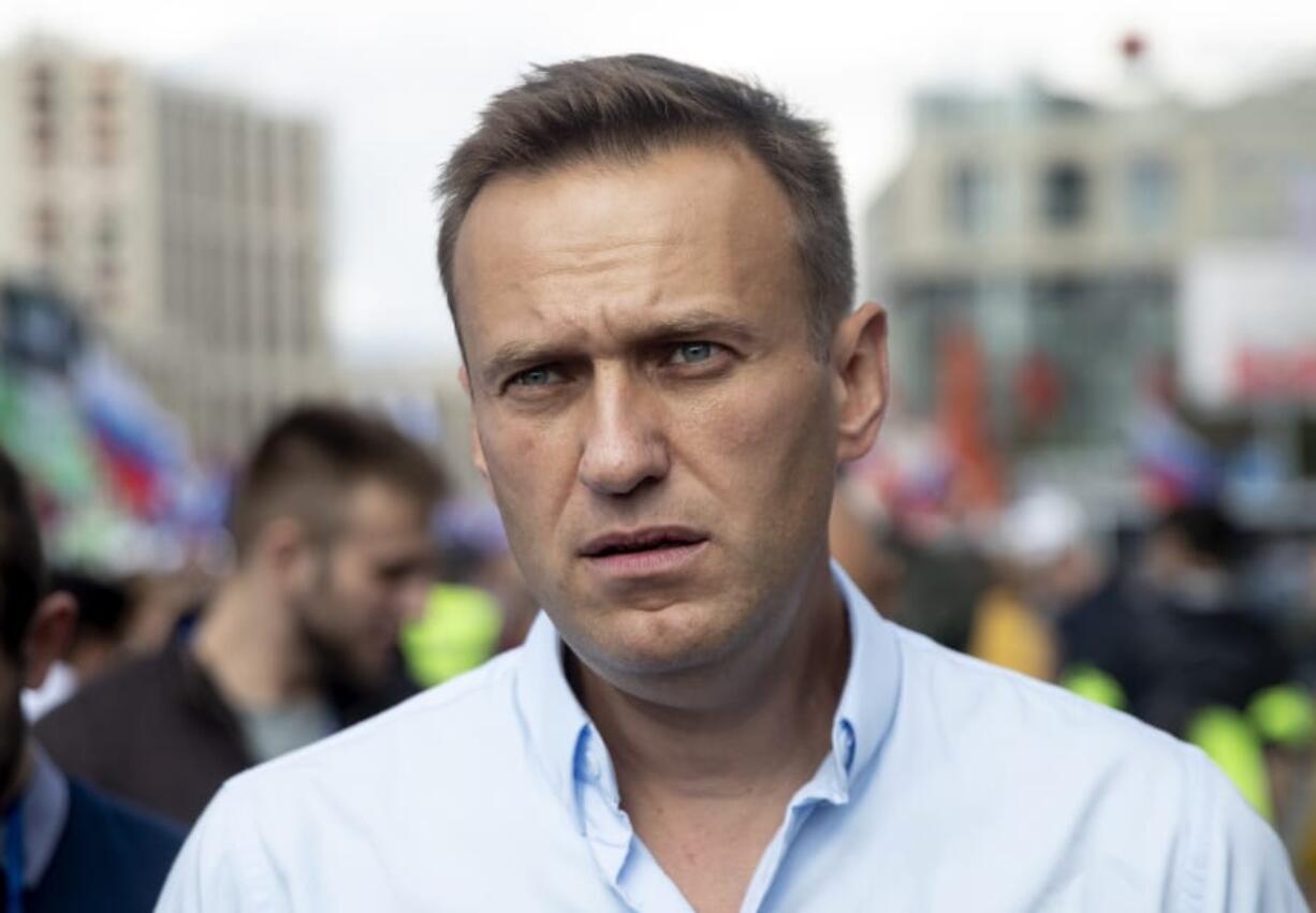 FILE - In this Saturday, July 20, 2019, file photo, Russian opposition leader Alexei Navalny attends a protest in Moscow, Russia. Navalny remained hospitalized for a second day on Monday, July 29, 2019, after his physician said he may have been poisoned. Details about Navalny’s condition were scarce after Navalny was rushed to a hospital Sunday from a detention facility where he was serving a 30-day sentence for calling an unsanctioned protest.