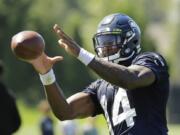 In this photo taken July 25, 2019, Seattle Seahawks wide receiver DK Metcalf makes a catch during NFL football training camp in Renton, Wash. (AP Photo/Ted S.