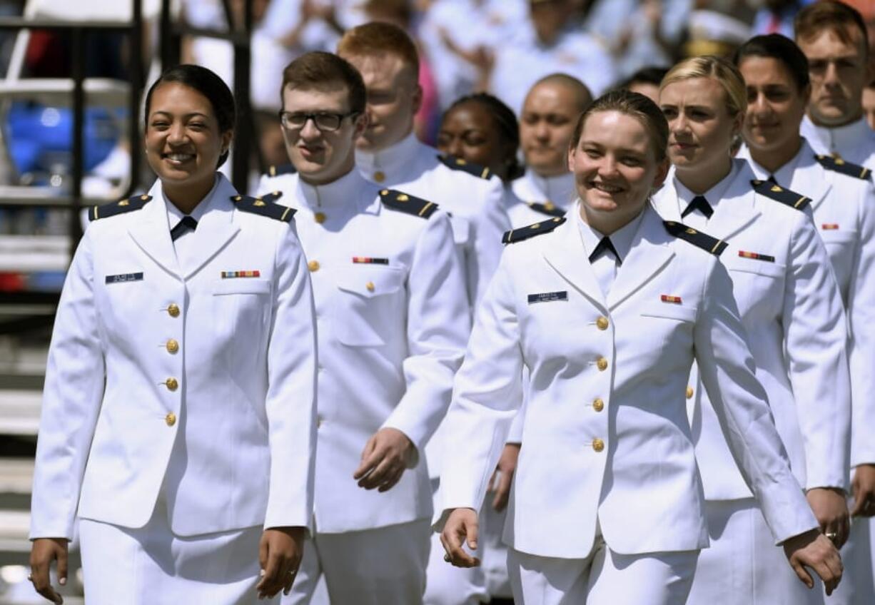 FILE - In this May 22, 2019 file photo, future United State Coast Guard graduates arrive at the commencement ceremony in New London, Conn. Released Wednesday, July 3, 2019, a Pentagon report from an anonymous 2018 gender relations survey shows that almost half of female cadets at the U.S. Coast Guard Academy said they experienced sexual harassment and about one in eight women reported experiencing unwanted sexual contact.