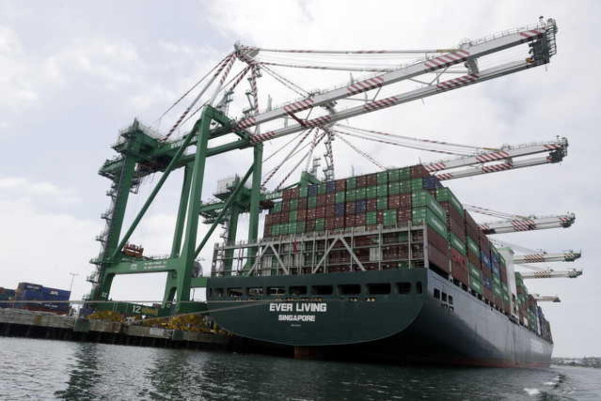 In this June 19, 2019, file photo a cargo ship is docked at the Port of Los Angeles in Los Angeles. On Wednesday, July 3, the Commerce Department reports on the U.S. trade gap for May.