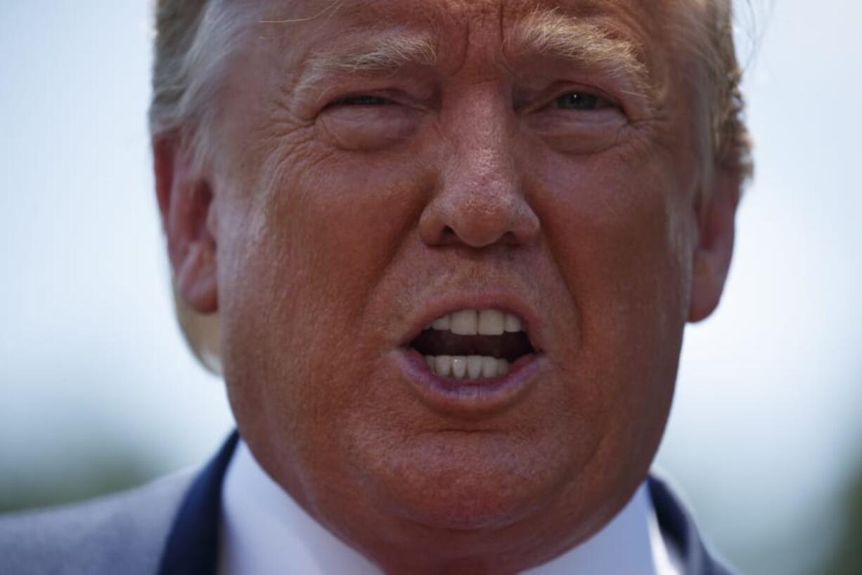 President Donald Trump talks with reporters on the South Lawn of the White House before departing to Japan for the G-20 summit, Wednesday, June 26, 2019, in Washington.