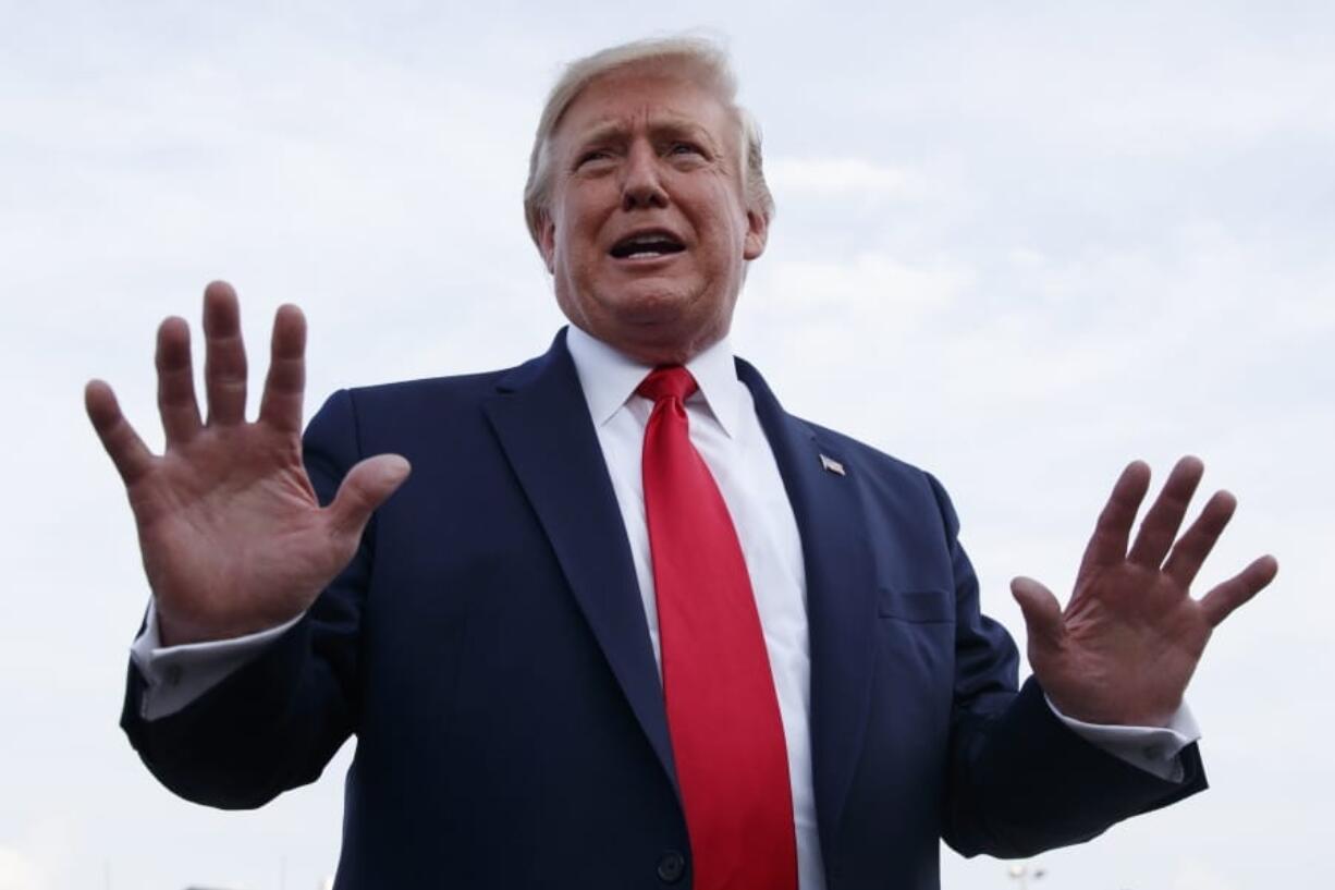 President Donald Trump speaks to the media as he arrives on Air Force One at Pitt Greenville Airport, in Greenville, N.C., Wednesday, July 17, 2019.