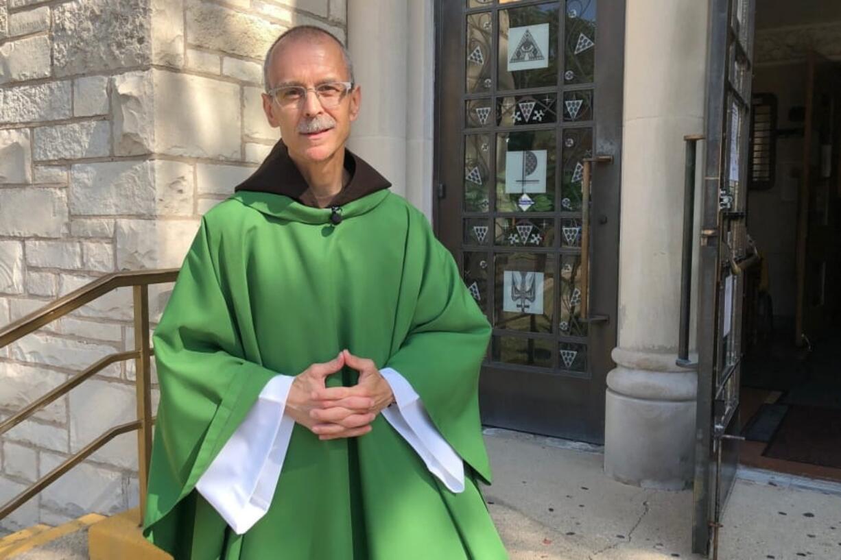 Rev. John Celichowski poses outside of the Saint Clare of Montefalco Catholic Church in Chicago. His congregation is made up of mostly immigrants and he used his Sunday homily to address community fears after President Donald Trump vowed stepped up immigration enforcements.