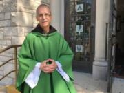 Rev. John Celichowski poses outside of the Saint Clare of Montefalco Catholic Church in Chicago. His congregation is made up of mostly immigrants and he used his Sunday homily to address community fears after President Donald Trump vowed stepped up immigration enforcements.