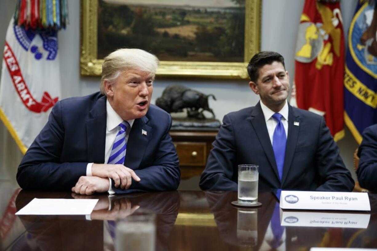 FILE - In this Sept. 5, 2018, file photo, then Speaker of the House Rep. Paul Ryan, R-Wis., listens to President Donald Trump speak during a meeting with Republican lawmakers in the Roosevelt Room of the White House in Washington. Trump unloaded an angry late-night tweetstorm on Ryan, calling Ryan a “lame duck failure” who “had the Majority and blew it away.” Ryan is very critical of Trump in the book “American Carnage” by Tim Alberta of Politico, which had excerpts in various publications this week.