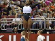 Simone Biles begins her floor exercise routine during the GK US Classic gymnastics meet in Louisville, Ky., Saturday, July 20, 2019. (AP Photo/Timothy D.