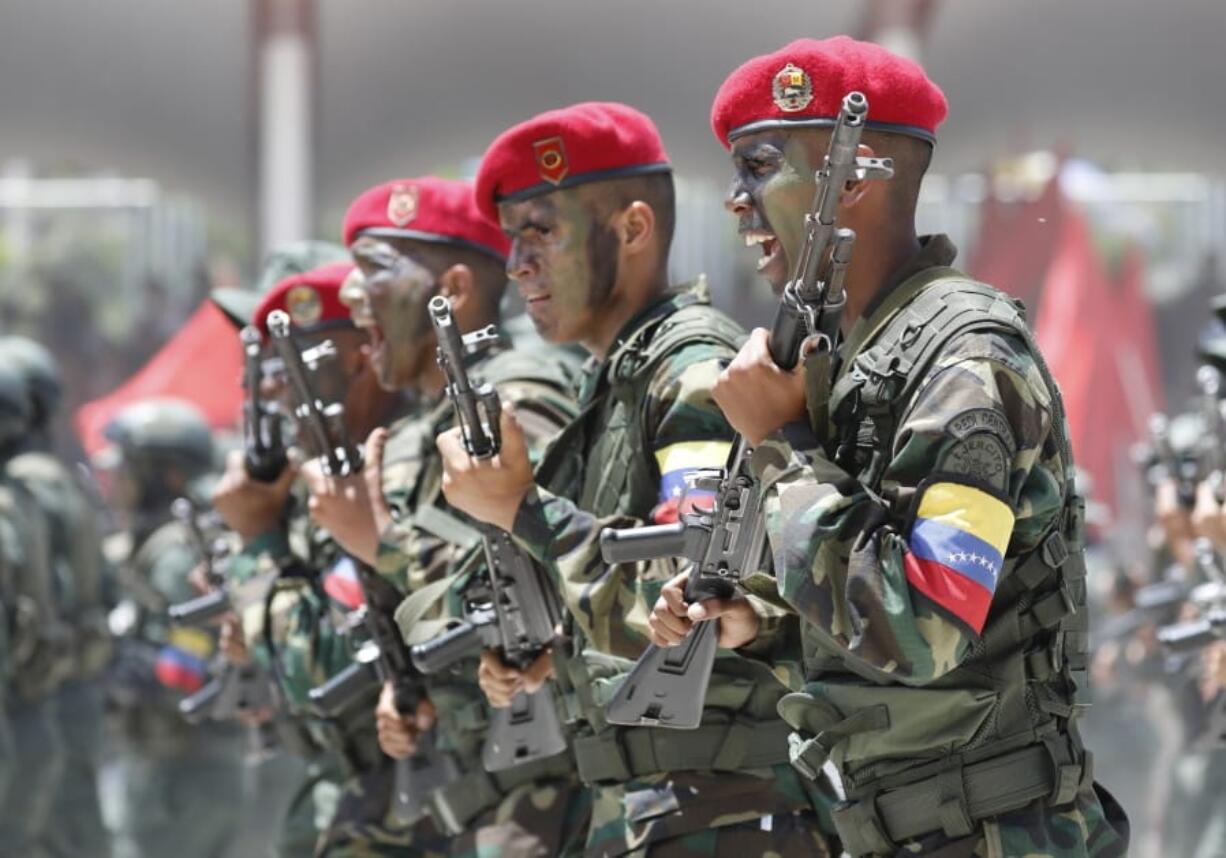 Soldiers march during a military parade marking Independence Day in Caracas, Venezuela, Friday July 5, 2019. Venezuela is marking 208 years of their declaration of independence from Spain.