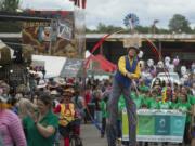 Topper Todd of Jest in Time, center, helps kick off the first day of the 2018 Clark County Fair in style while joining a parade at the fairgrounds.