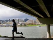 A runner makes his way on the Eastbank Esplanade.