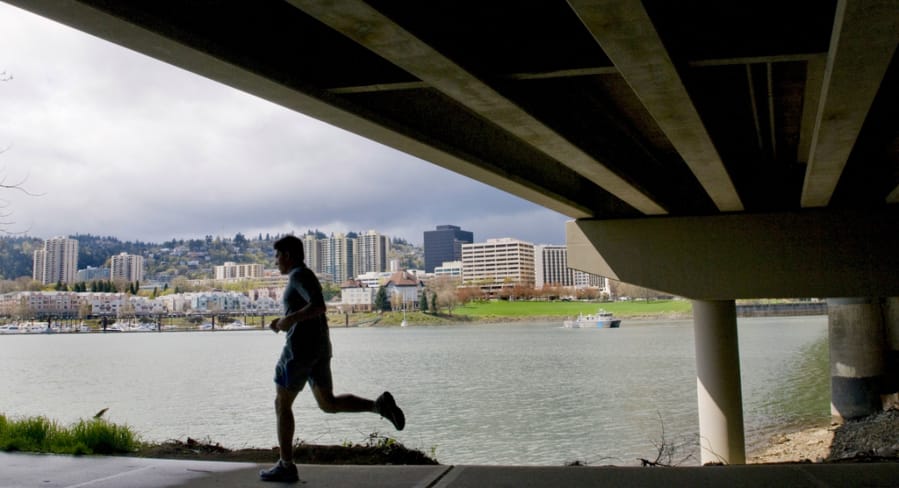 A runner makes his way on the Eastbank Esplanade.