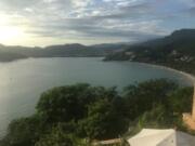 Playa de Ropa, at right, is a popular draw for tourists in Zihuatanejo, Mexico.