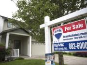 A For Sale sign is seen in front of a home in Felida. Clark County’s housing market grew in July, with more new listings than in any prior month this year. But sales rates climbed as well, keeping the overall inventory in months unchanged.