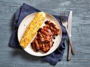 Grilled Chicken Thighs With Blueberry Barbecue Sauce.