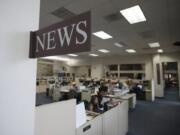 Staff members of The Columbian work in the newsroom Friday afternoon, June 10, 2016.