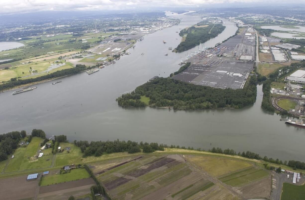 The Columbia River, left, merges with the Willamette River with Kelley Point Park in June 2010 in Vancouver. A new survey reveals the West Coast has lost about 85 percent of its historical estuary habitat, but the mapping could also help identify restoration opportunities and provide a baseline for predicting future changes.